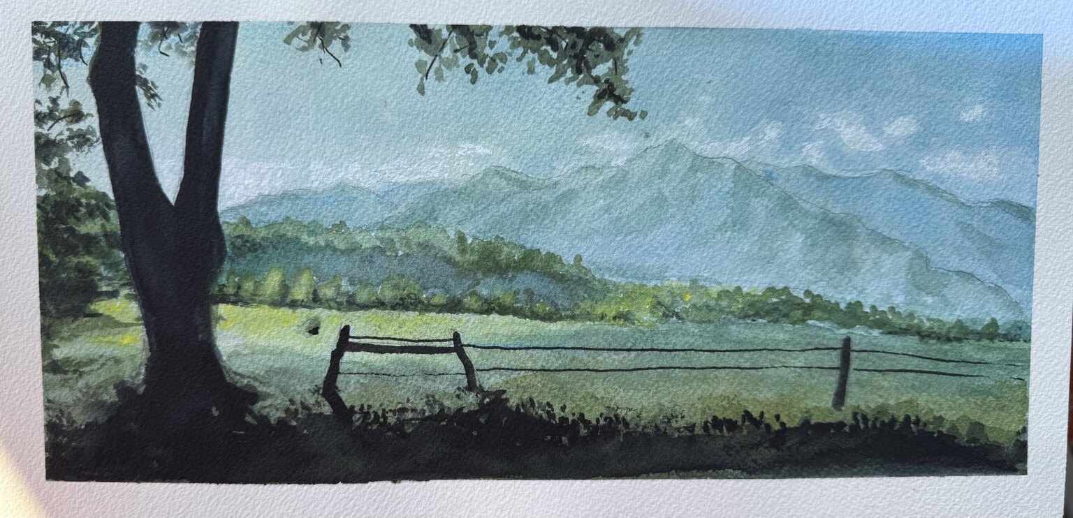 Panoramic watercolor landscape with a dark foreground tree and fence overlooking fields and blue mountains.