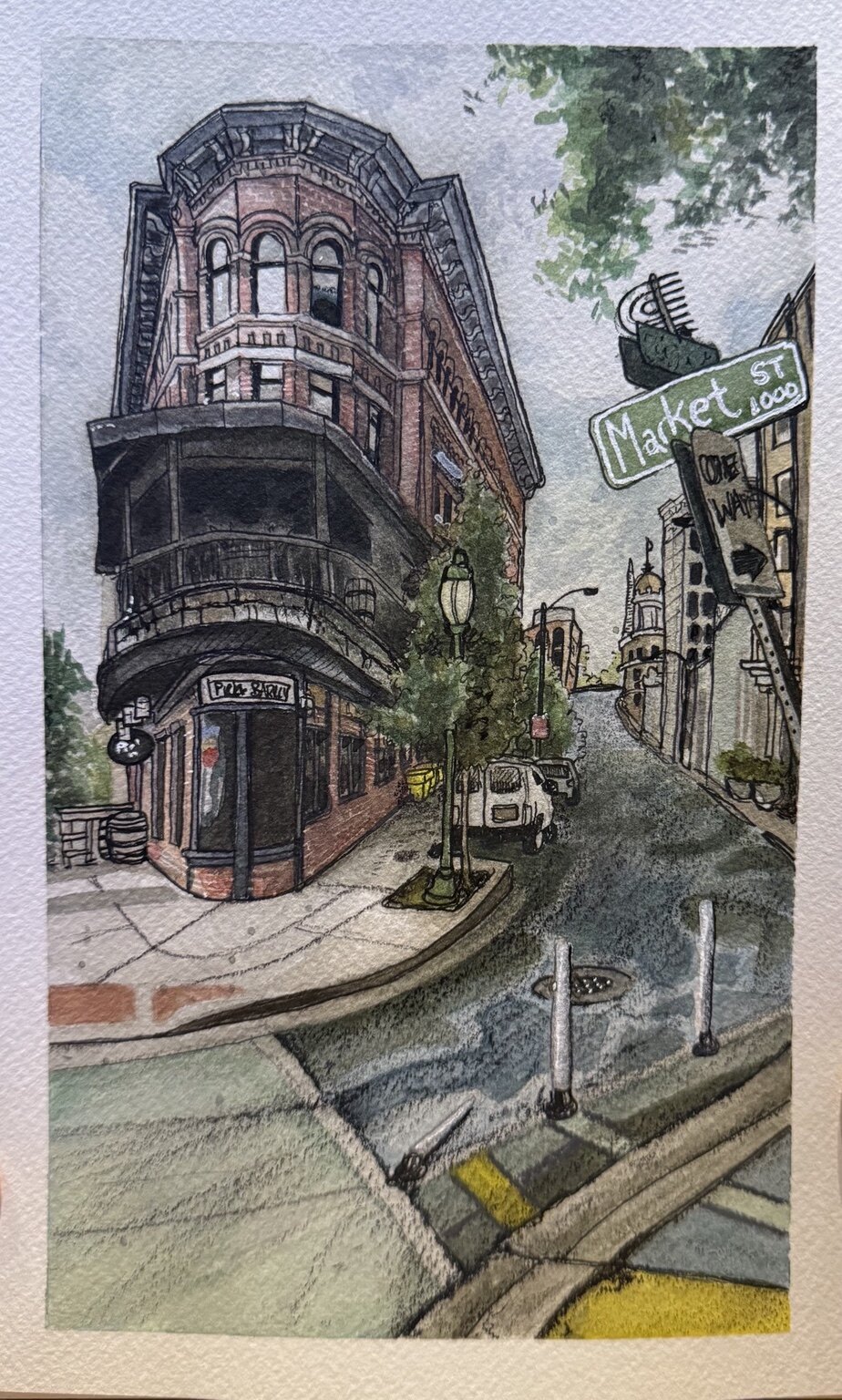 Watercolor and ink painting of a narrow brick building at a Market Street corner in Chattanooga.